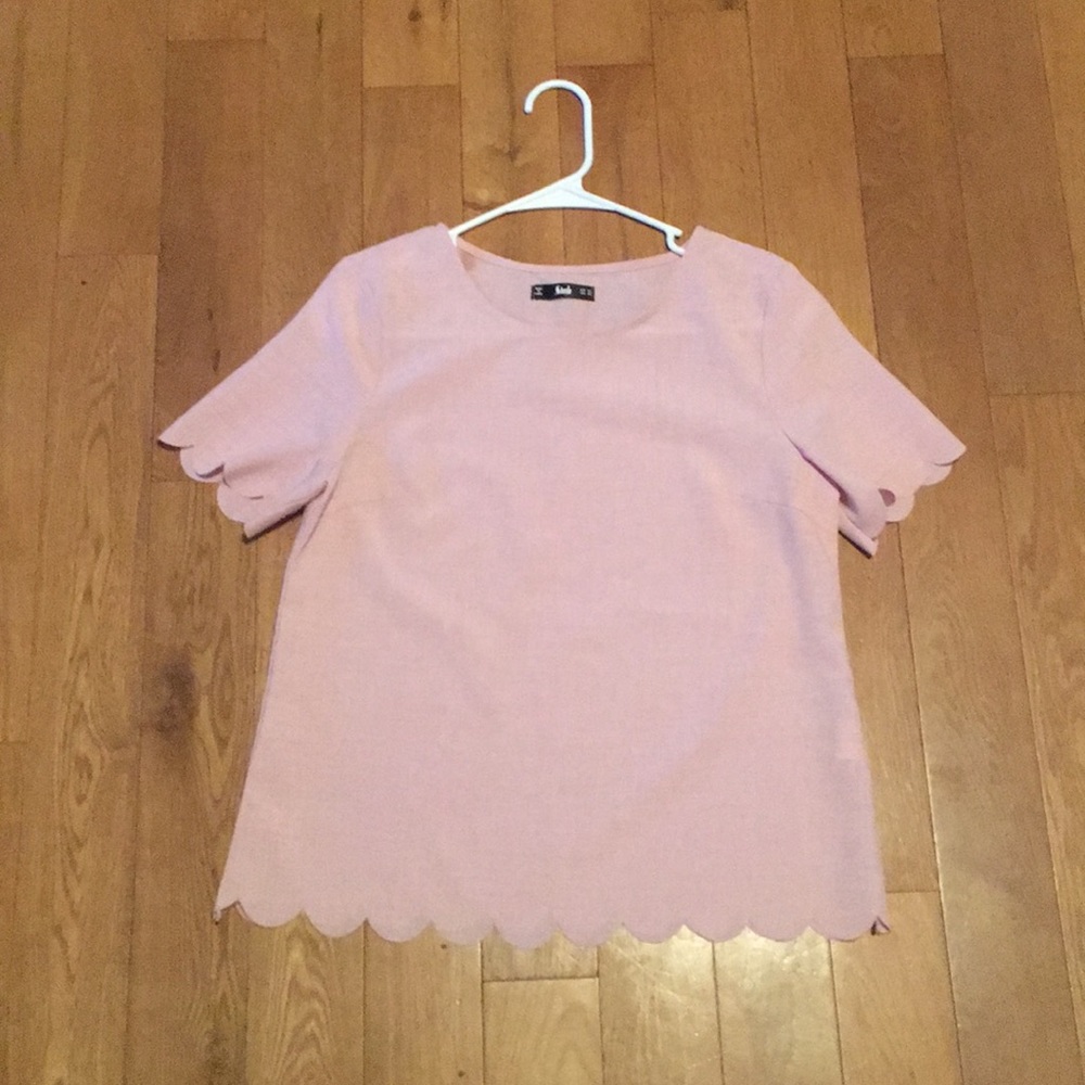 Scalloped edged pale pink blouse
